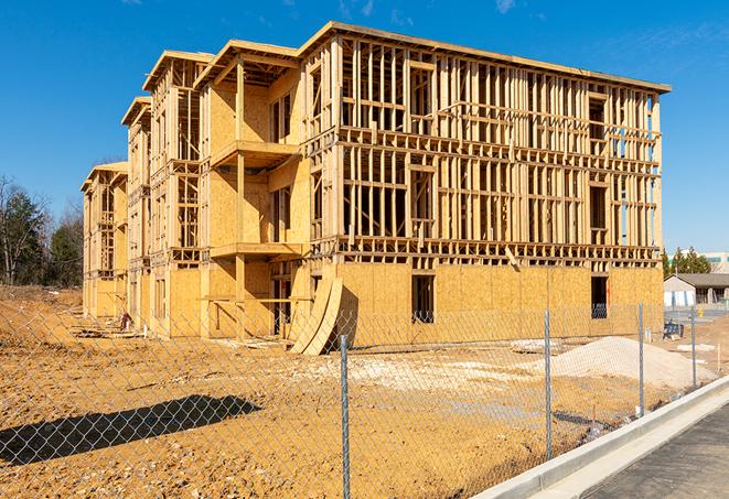 a close-up of temporary chain link fences enclosing a job site, signaling progress in the project's development in Ellenton, FL